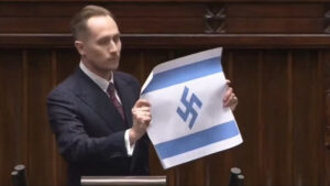 ПОСЛАНИК У ПОЉСКОМ ПАРЛАМЕНТУ ПОКАЗАО ЗАСТАВУ ИЗРАЕЛА СА СВАСТИКОМ